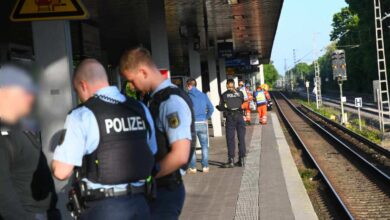 a group of police officers at a train station
