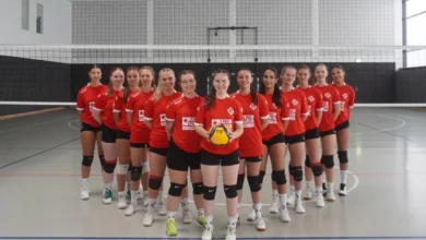 a group of women in sports uniforms