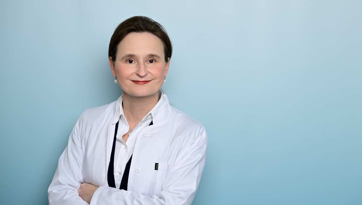 a woman in a white coat
