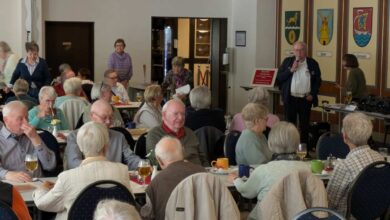 a group of people sitting at tables