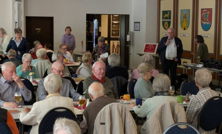 a group of people sitting at tables