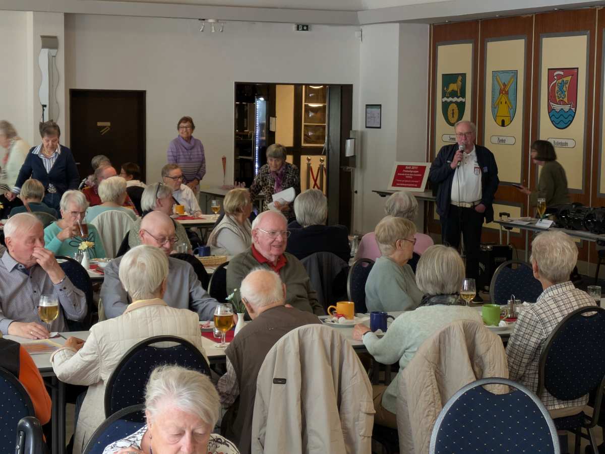 a group of people sitting at tables