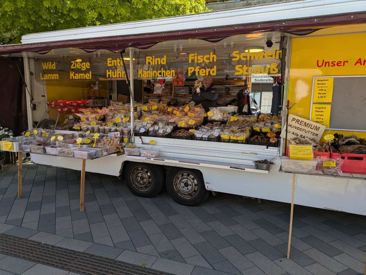 a food stand with a man standing in front of it