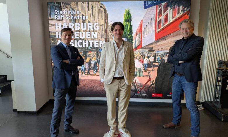 a group of men standing in front of a poster