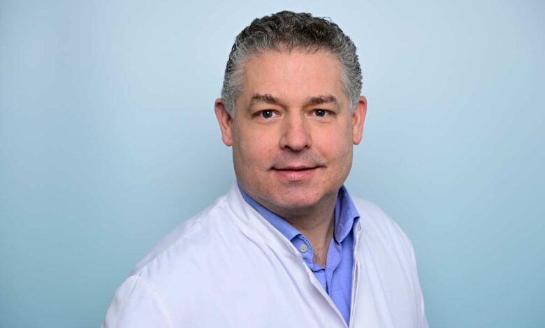a man in a white coat