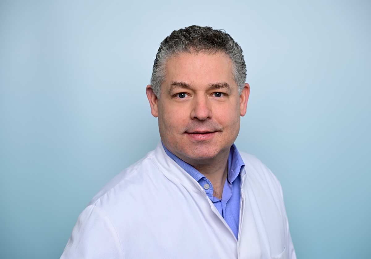 a man in a white coat