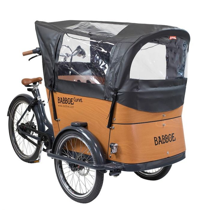 a bicycle with a covered trailer