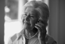 a woman holding a phone to her ear