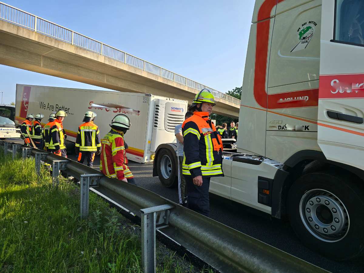 a group of people in safety gear standing next to a truck