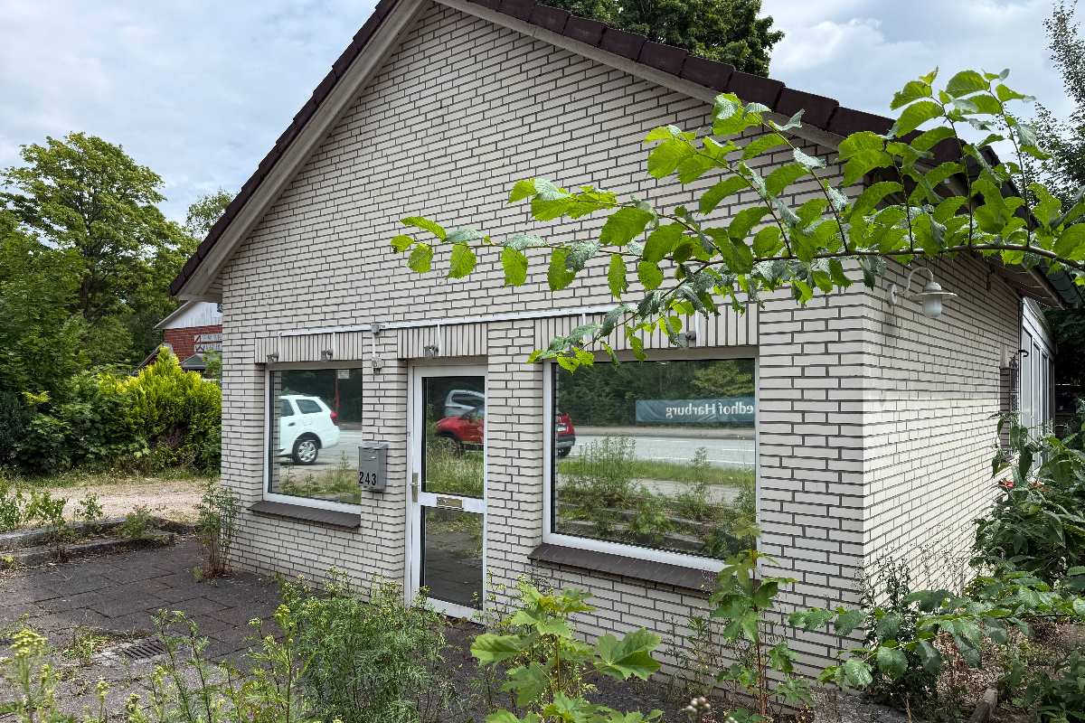 a building with windows and a car parked in the front