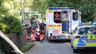 a group of people in uniform and a ambulance