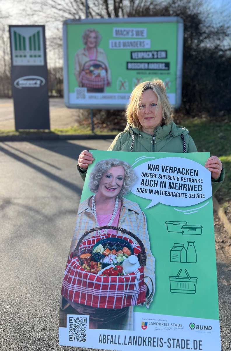 a woman holding a sign