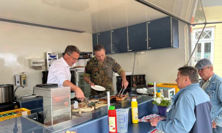 a group of men cooking in a kitchen
