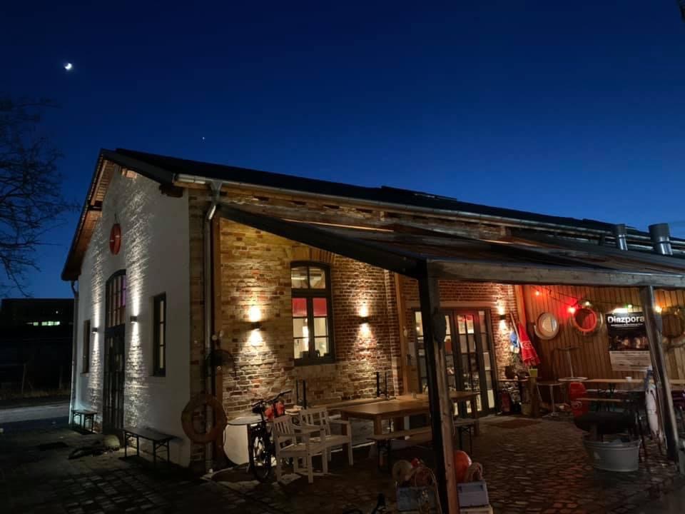 a building with a brick wall and a brick patio