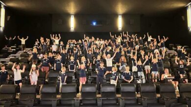 a group of people standing in a theater