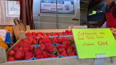 a box of strawberries in a market