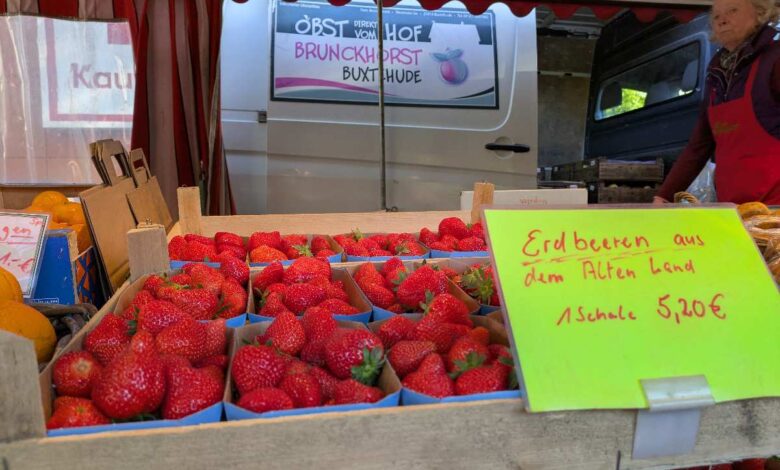 a box of strawberries in a market