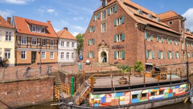 a boat on a canal next to a building