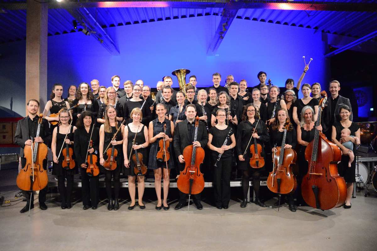 a group of people holding instruments