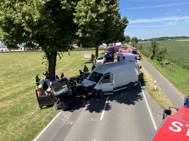 a group of emergency vehicles on the side of a road