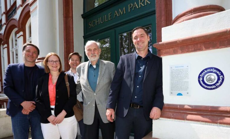 a group of people standing in front of a building