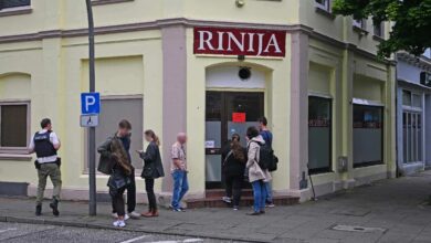 a group of people standing outside a building