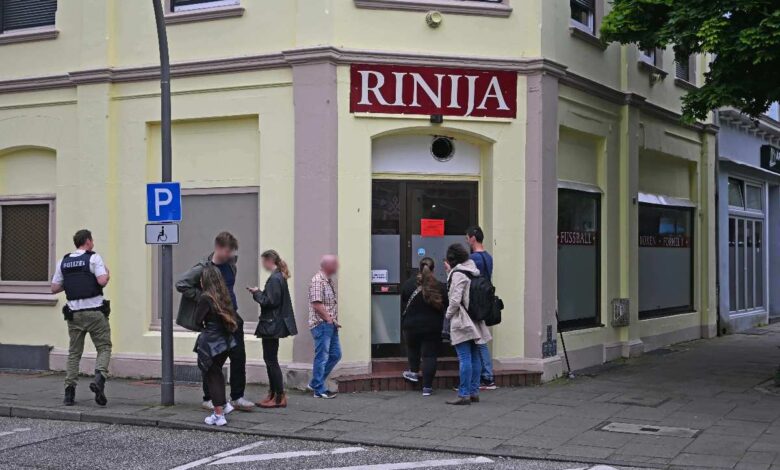 a group of people standing outside a building