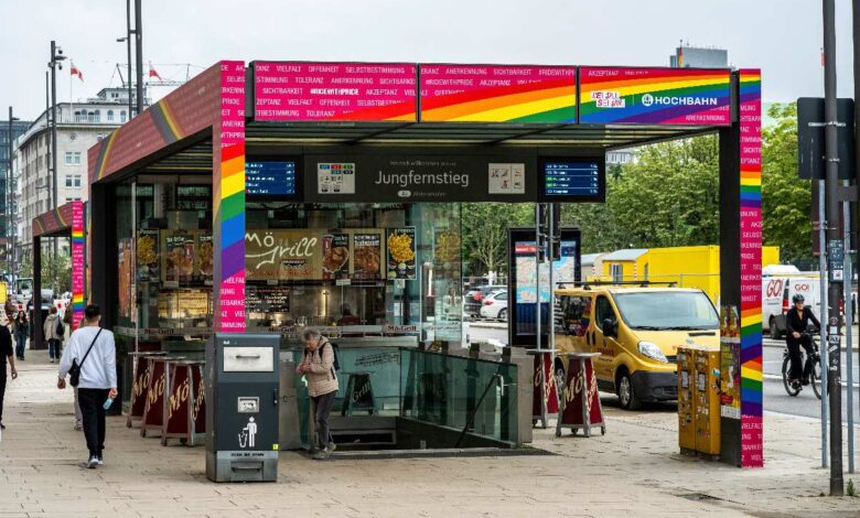 a food stand with a rainbow sign