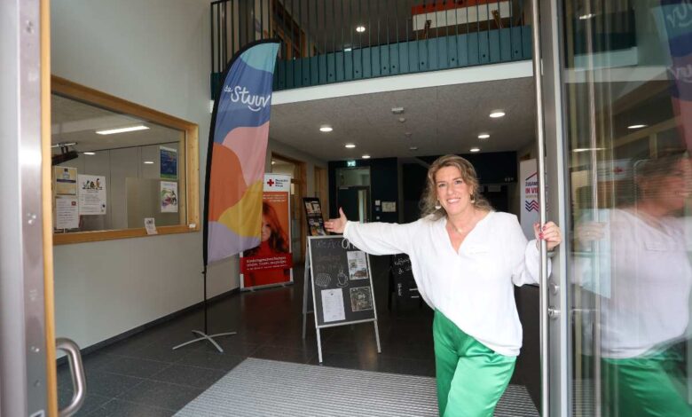 a woman in green pants and white shirt