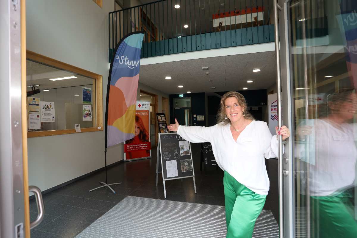 a woman in green pants and white shirt
