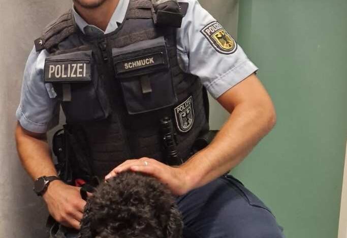 a man in a uniform with a dog