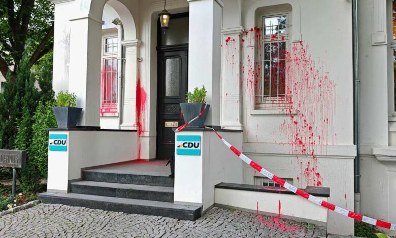 a house with red paint on the front