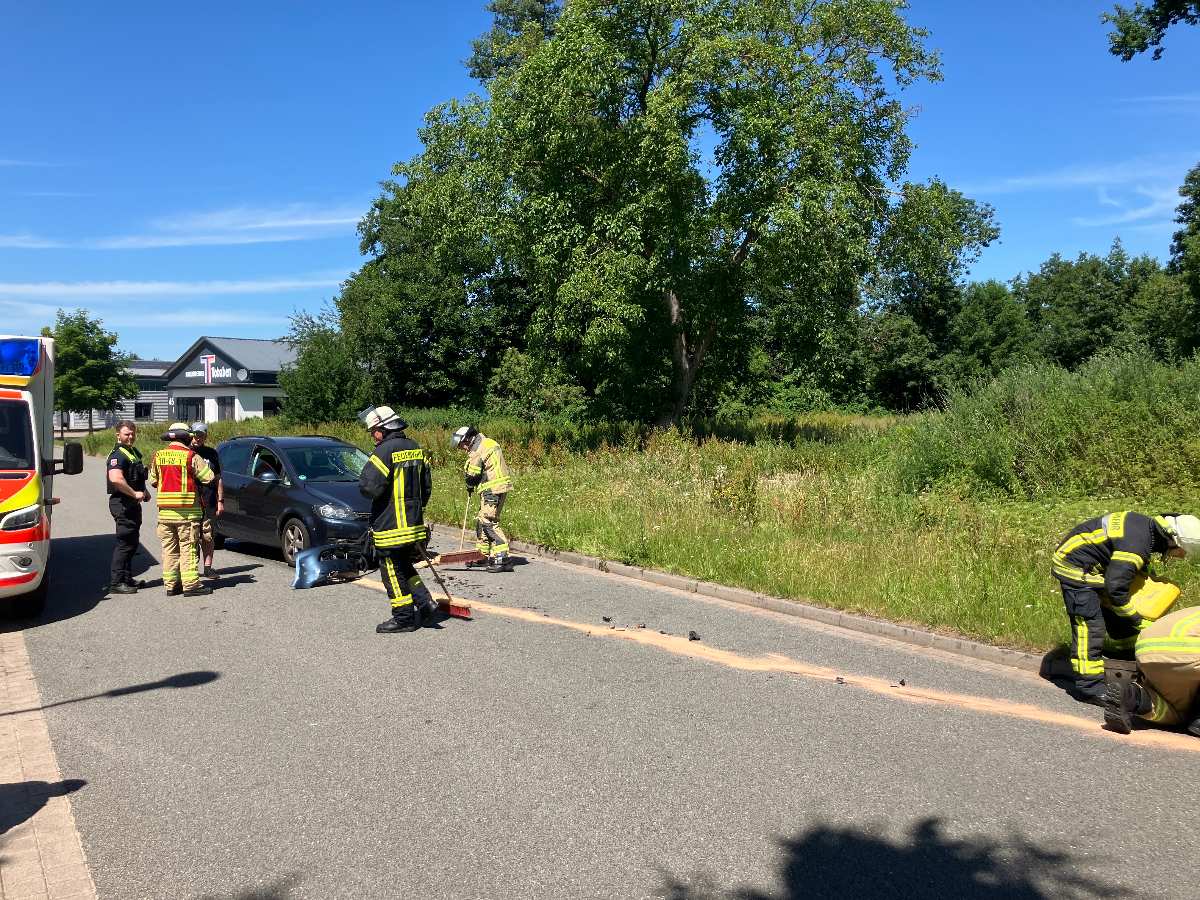 a group of firefighters standing on the side of a road
