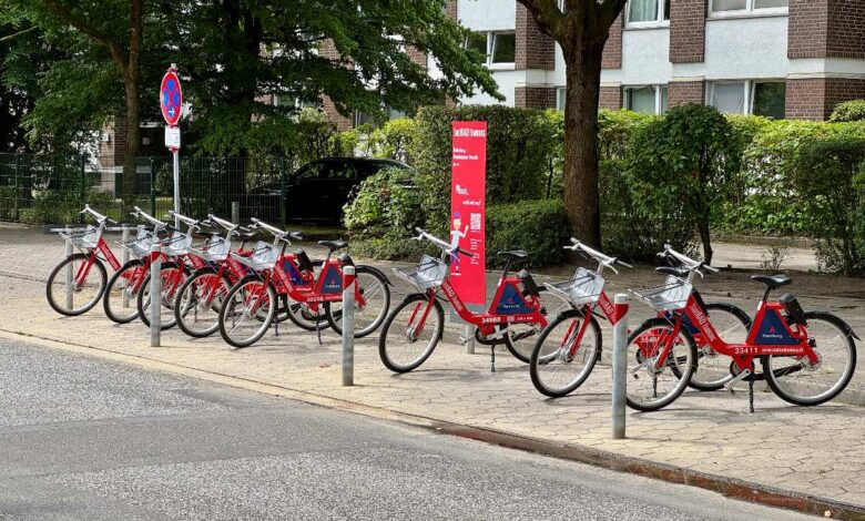 a row of bicycles on a sidewalk