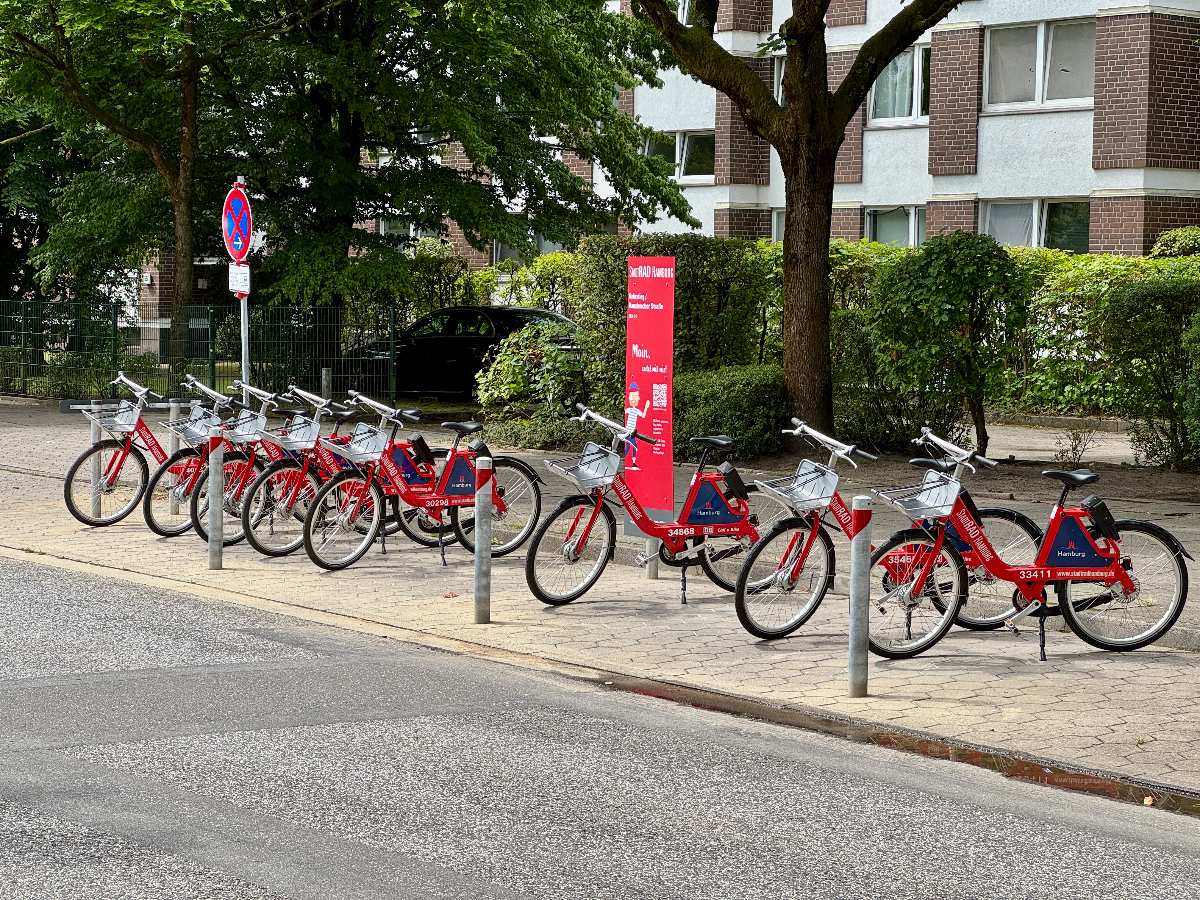 a row of bicycles on a sidewalk