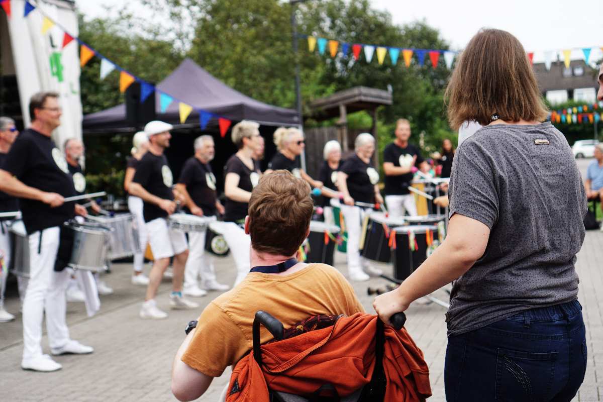 a group of people playing drums