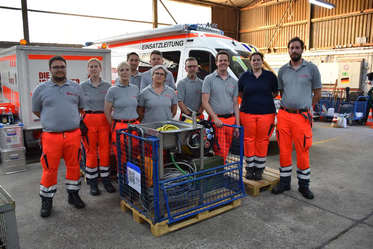 a group of people standing in front of a van