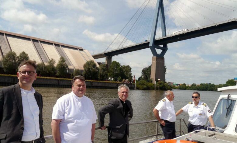 a group of men standing on a boat