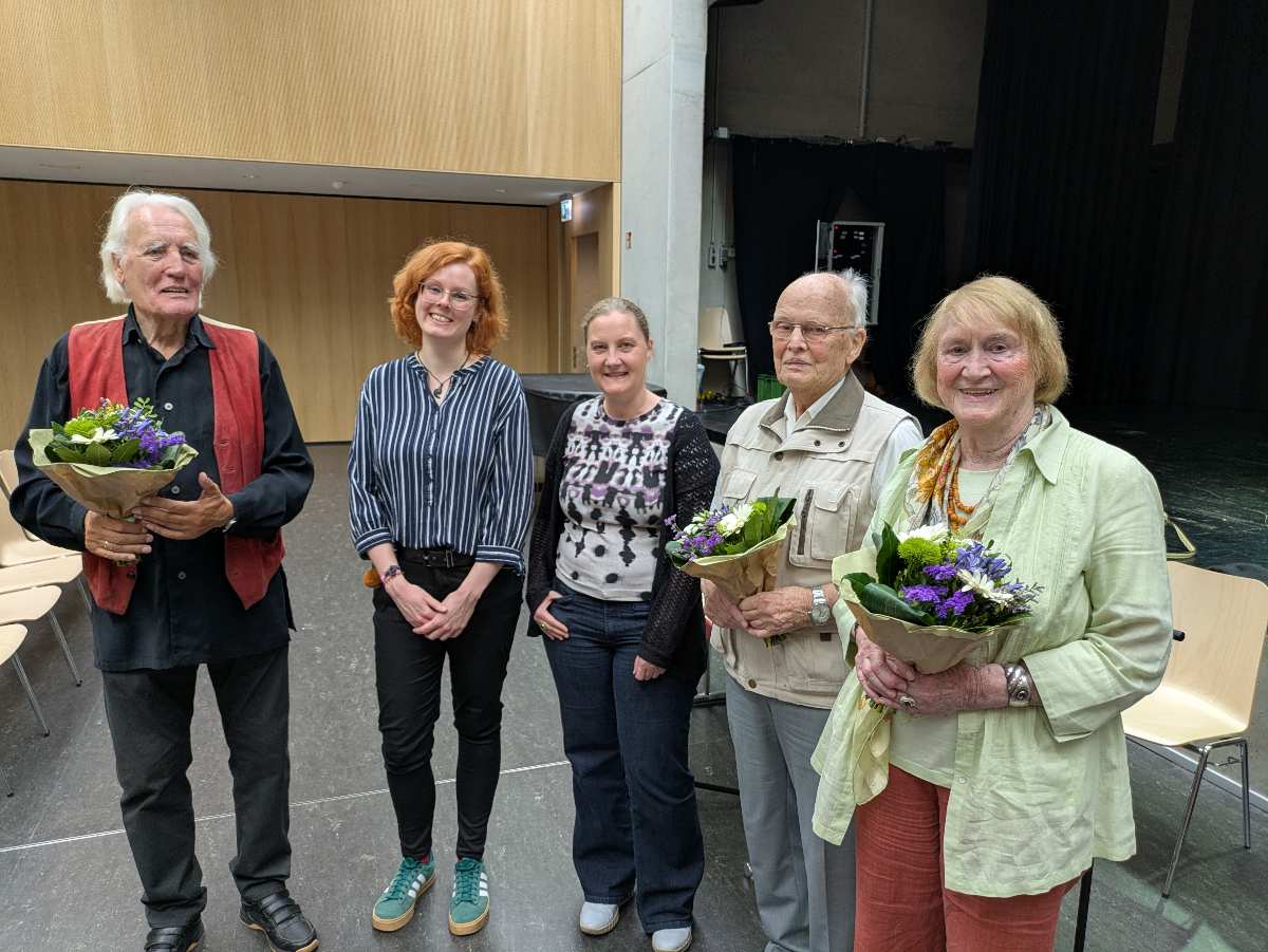 a group of people posing for a photo