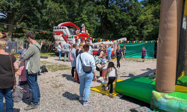 a group of people standing in a yard