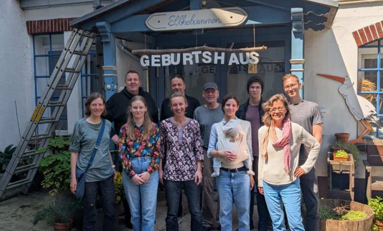 a group of people standing in front of a building
