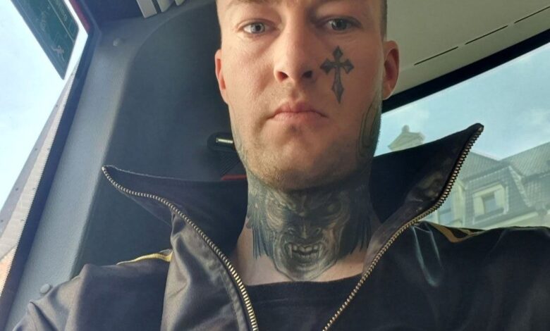 a man with a tattoo on his neck