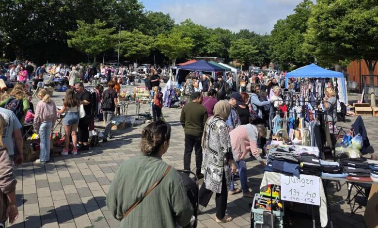 a group of people at a flea market