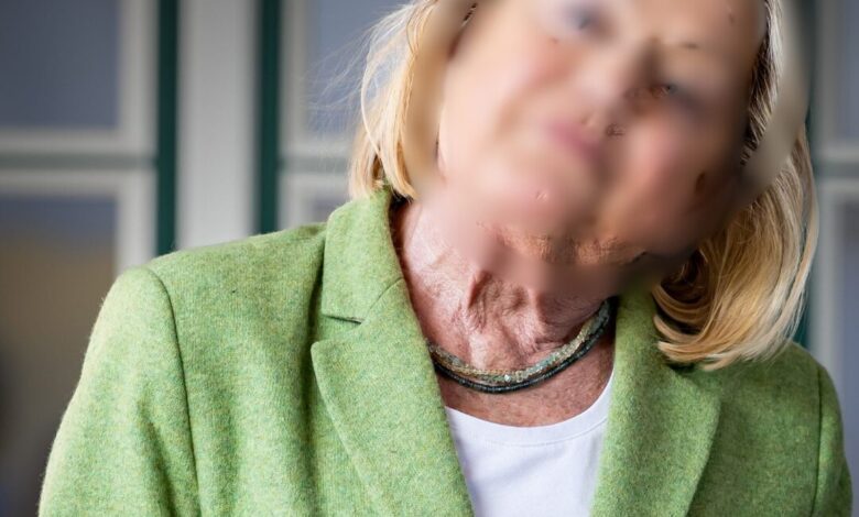 a woman in a green suit