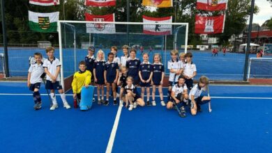 a group of kids on a blue court