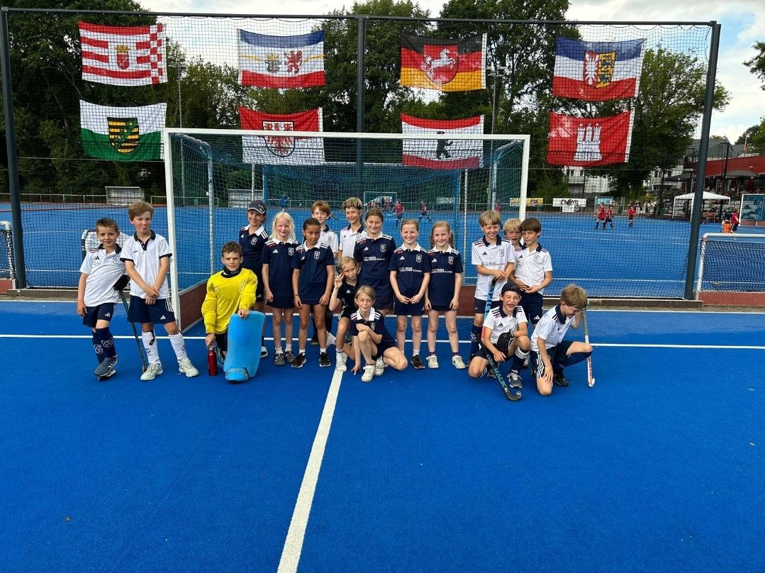 a group of kids on a blue court