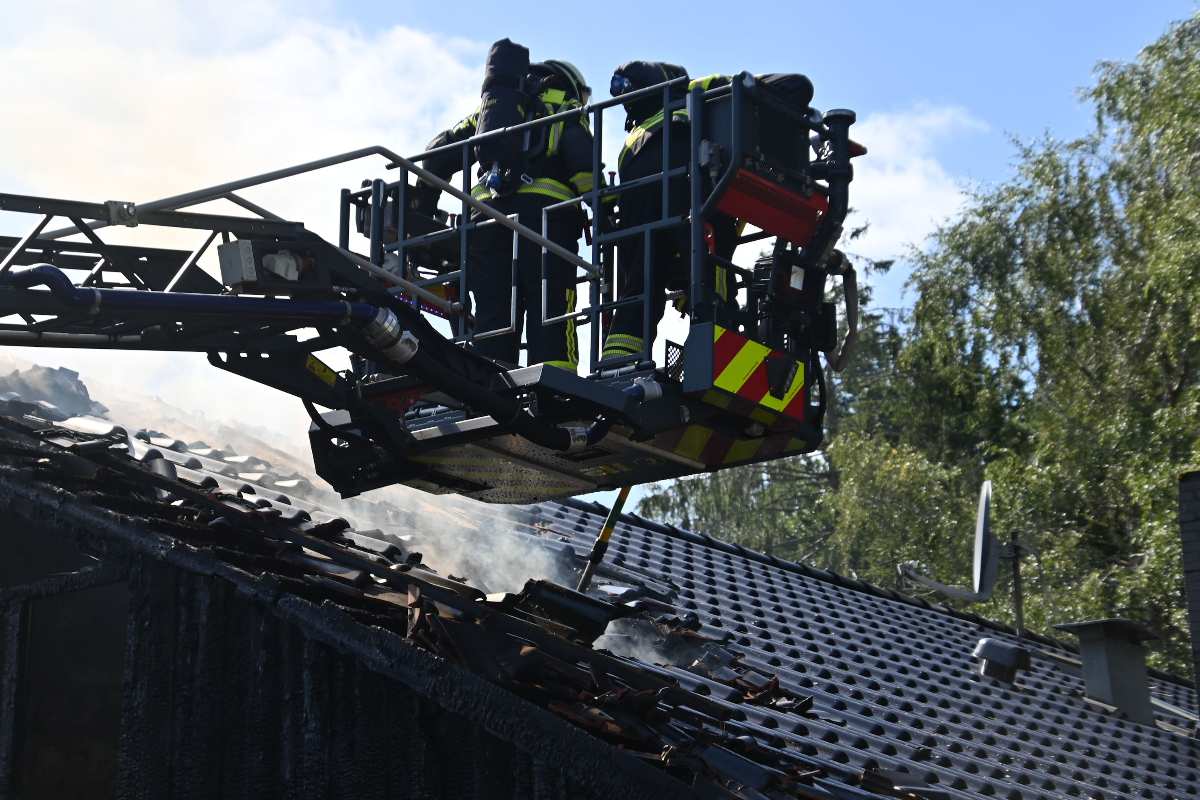 firefighters on a roof