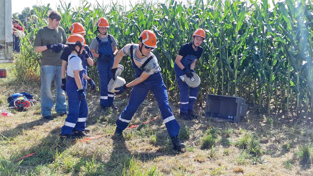 a group of people in overalls and helmets