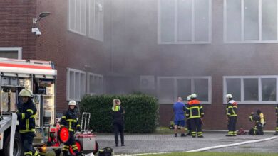 a group of firefighters outside a building