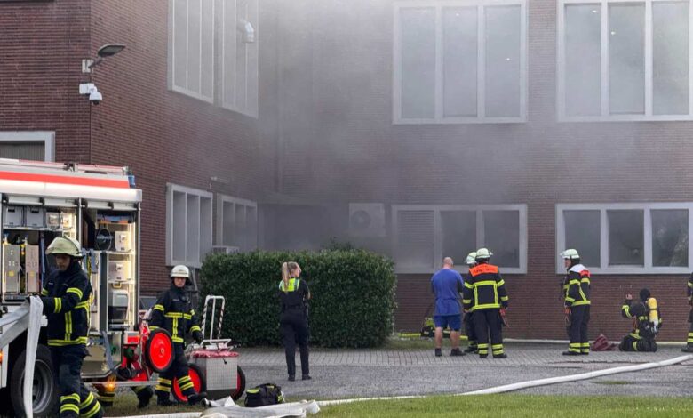 a group of firefighters outside a building